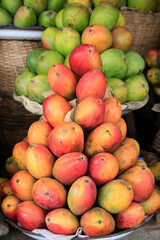 African market. Fresh mangoes on a platter. Togo.