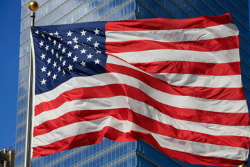 Fototapeta premium American flag fluttering in the wind. New York. USA.