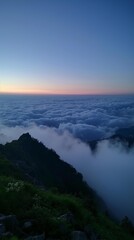 AI generator image of  large area of sky, sunset, sea of clouds, lawn on the top of the mountain, ultra-wide angle, morning fog, loneliness, deep city, lonely atmosphere,