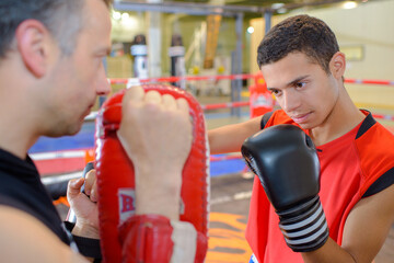 coach and man in boxing class