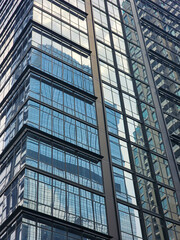 Obraz premium Modern blue-glass window architecture of office buildings in Jakarta. Business and finance concept.
