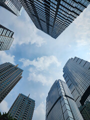 Fototapeta premium Amazing long-angle view of modern office buildings. Business and finance concepts.