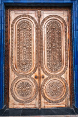 Wooden door with carved islamic pattern Uzbek ornament in the Museum of Victims of Political Repression in Tashkent in Uzbekistan