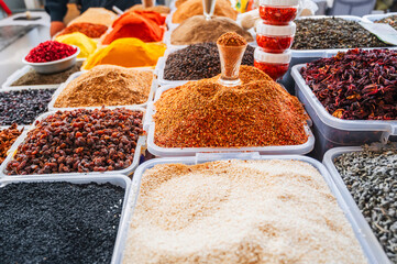 assortment of various oriental spices and seasonings on the counter at the Asian bazaar