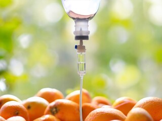 Natural orange fruits vitamin c nutrition iv drip therapy drug treatment concept.