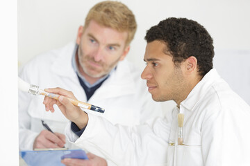 apprentice decorator being assessed while working