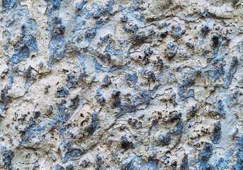 Old white, blue painted wall.