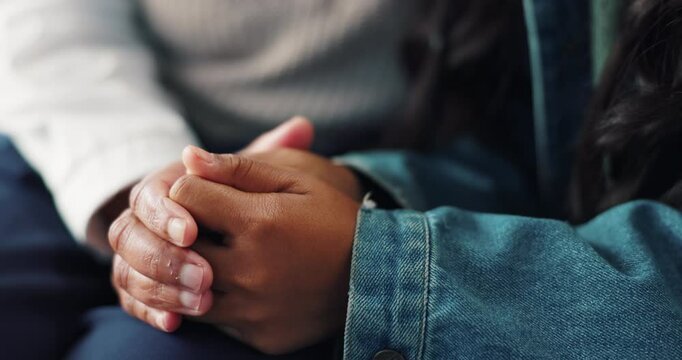 Child, psychologist and hands with care for consultation, understanding or advice at therapy session. Closeup of people or therapist touching in support or love for help, couseling or trust together