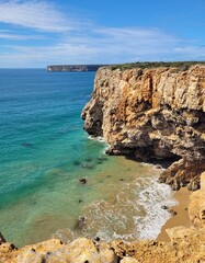 Fototapeta premium Cliffs and turquoise water from above, Algarve, Portugal
