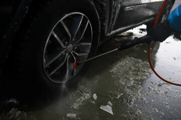 Self-service express car wash. Outdoor high pressure washing for cars.