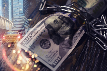 The American currency is dollars, tied with a chain. double exposure business city