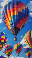 Naklejka premium Colorful hot air balloons in a clear blue sky, uplifting adventure concept