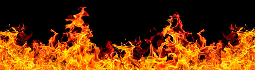 Fototapeta premium Flames dancing against a black background