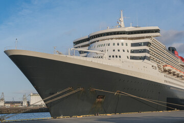 Legendary luxury ocean liner Queen Mary 2 cruiseship cruise ship at Steinwerder terminal in Hamburg port, Germany on sunny day