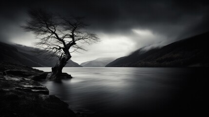 A black and white photograph of the mystical and mysterious Loch Ness in Scotland, capturing the haunting beauty of its deep, dark waters.
