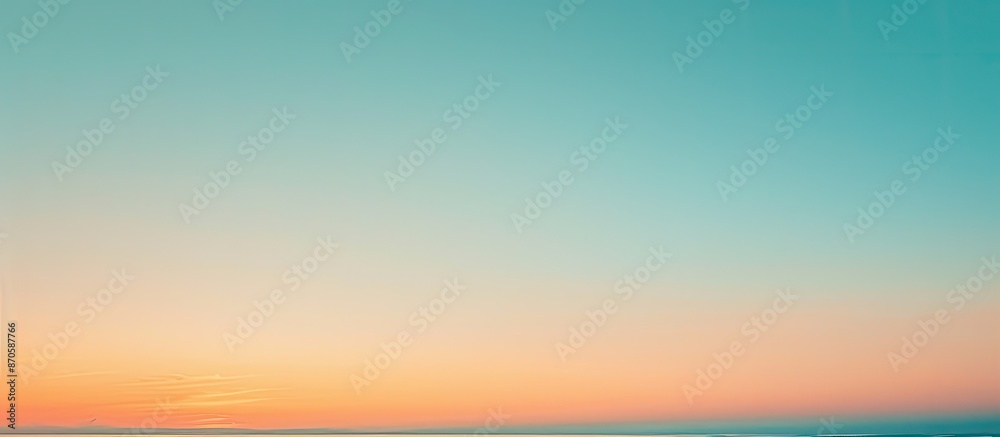 Poster copy space image of a serene early morning sky with a smooth gradient of orange and blue hues, perfe