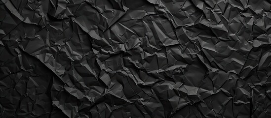 Fototapeta premium Background featuring a texture of crumpled black paper with a design suitable for including copy space image.