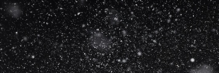 Obraz premium Falling Snowflakes on a Dark Background