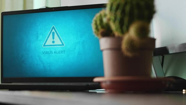Virus alert sign flickering on laptop screen