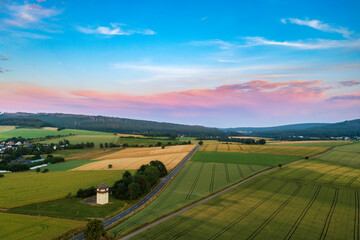 Fototapeta premium Bird's eye view of a replica of a Roman watchtower on the Limes near Idstein in the Taunus at sunset