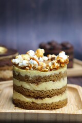 Assorted Seasonal mini cakes. Hazelnut, Opera, Salted Caramel, and Double Chocolate. Endless variety, easy serving, moist layers, rich frosting. A symphony of flavor in every bite. Bakery products.