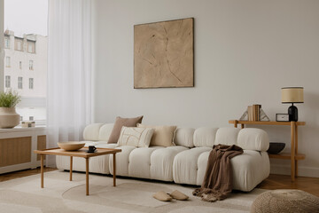 Cosy and stylish interior design of living room with modular white sofa, wooden furnitures, paintings on the wall, decorations, windowsill and personal accessories. Home styling. Template.