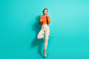 Full length photo of nice woman wear crop top rucksack hold book jumping back to high school...