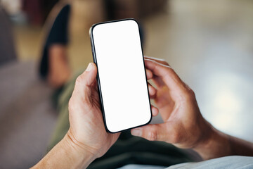 cell phone blank white screen mockup.hand holding texting using mobile on desk at office.background empty space for advertise.work people contact marketing business,technology
