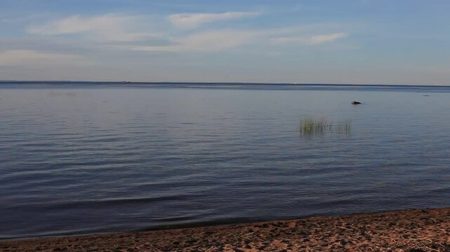 Wide Shot of Seascape: Gentle Sunset on the Sea in Summer
