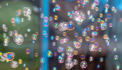 Soap bubbles fly as an abstract background.