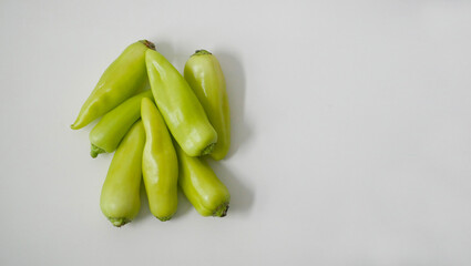 Green sweet eco bio pepper paprika on white background. Concept of farming and environmentally friendly organic local products