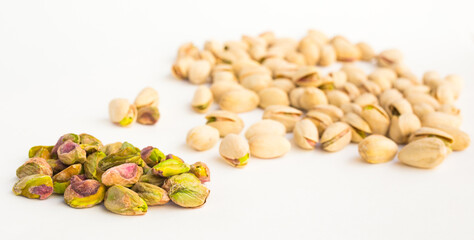 Roasted pistachios on white background