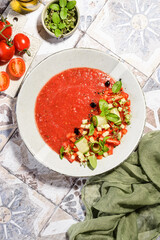 gazpacho food styling on a tile background