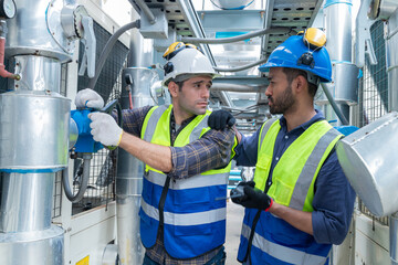 Engineer under checking the industry chilled water fan coil unit air conditioner is water cooling...