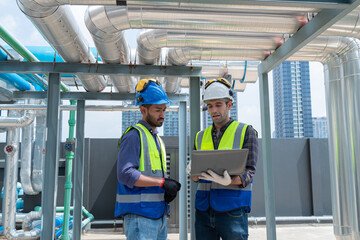 Engineer under checking the industry chilled water fan coil unit air conditioner is water cooling...