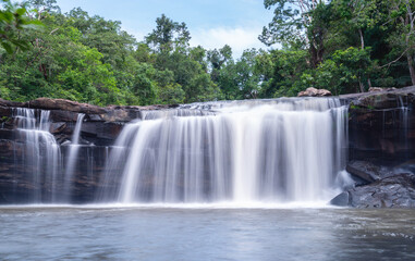 Fototapeta premium River stream waterfall in forest landscape, beautiful nature water stream with rocks in the tropical forest.Abundant forest.Wangyai waterfall ,Sisaket,Thailand.