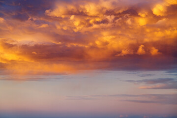 Incredible colorful sunset with cloudy sky lit by the sun.