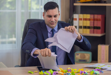 Frustrated Businessman Reviewing Documents