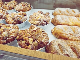 Almond Monkey Bread and Chocolade Croissant in showcase of bakery