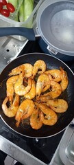 frying pan with grilled chicken