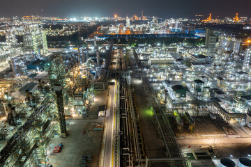 Fototapeta premium Petroleum chemical factory illuminated at night