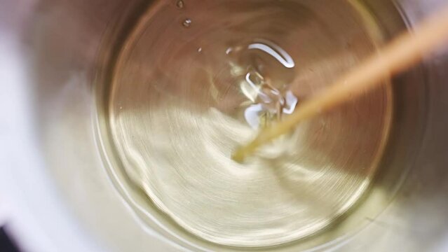 The process of melting coconut wax for candles. Production of scented candles for the interior. hobbies and business idea.