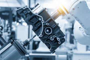 Closeup scene the milling spindle attached on the robotic arm finish cut the aluminum gear case.