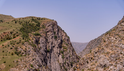 A mountain range with a clear blue sky