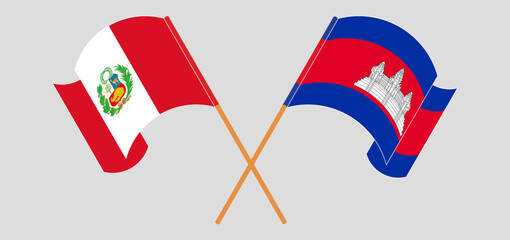 Crossed and waving flags of Peru and Cambodia