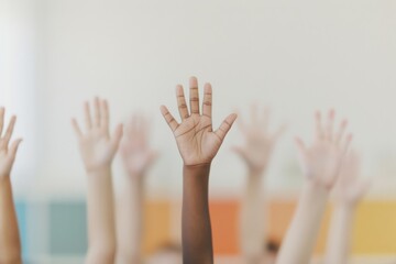Diverse Hands Raised Together in Solidarity Against Colorful Background