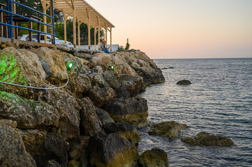 Sunset in Cyprus. View of coast at sunset.. Promenade of the Mediterranean sea.