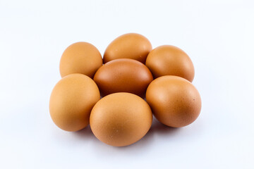 group of  seven raw asian chicken eggs on white isolated background