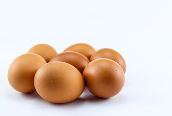 group of  seven raw asian chicken eggs on white isolated background