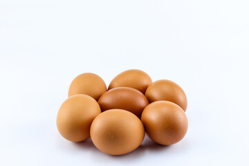 group of  seven raw asian chicken eggs on white isolated background